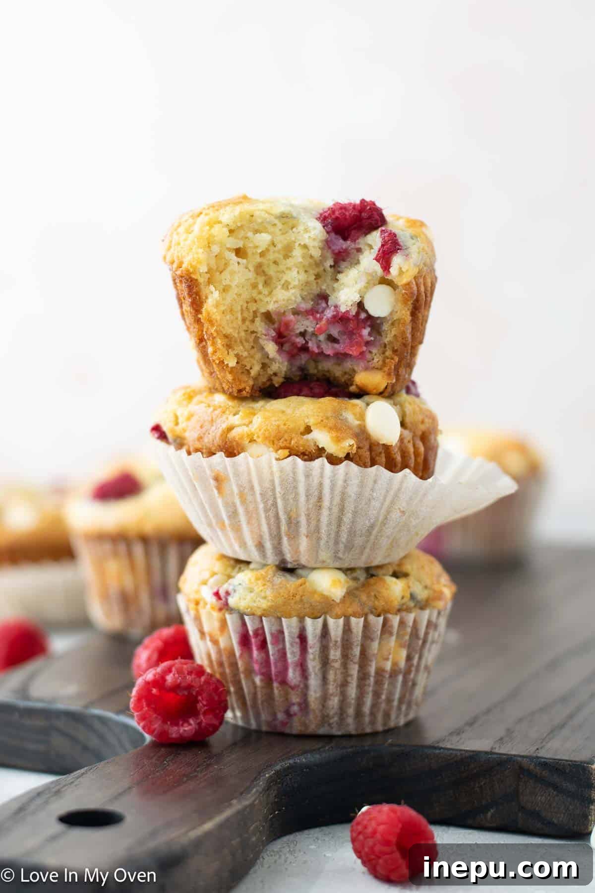 Luscious Raspberry White Chocolate Muffins 2 Delightful Raspberry White Chocolate Muffins, perfectly baked and ready to enjoy