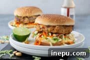 Thai Turkey Burgers on a plate with fresh ingredients