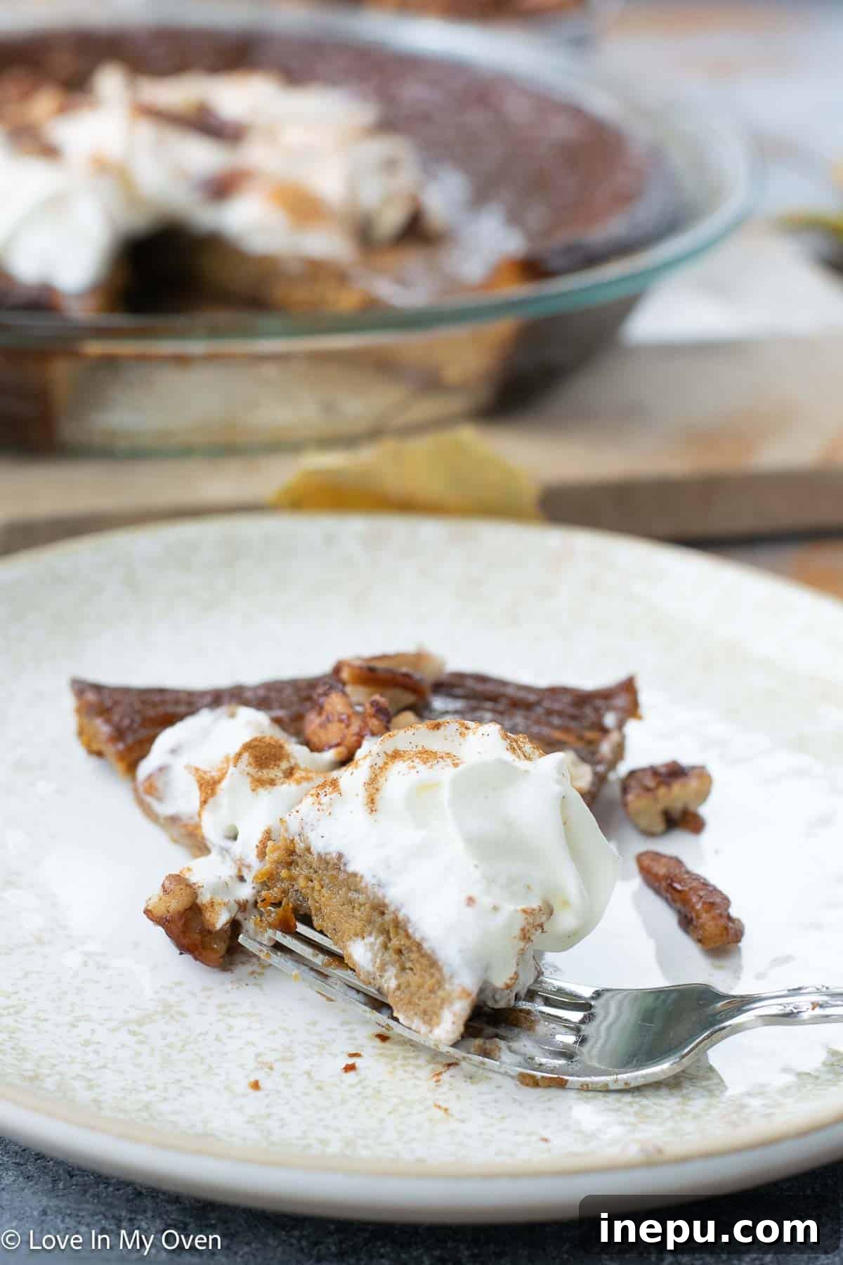 Silky Pumpkin Custard 6 Crustless pumpkin pie served on a rustic wooden board with autumn decorations
