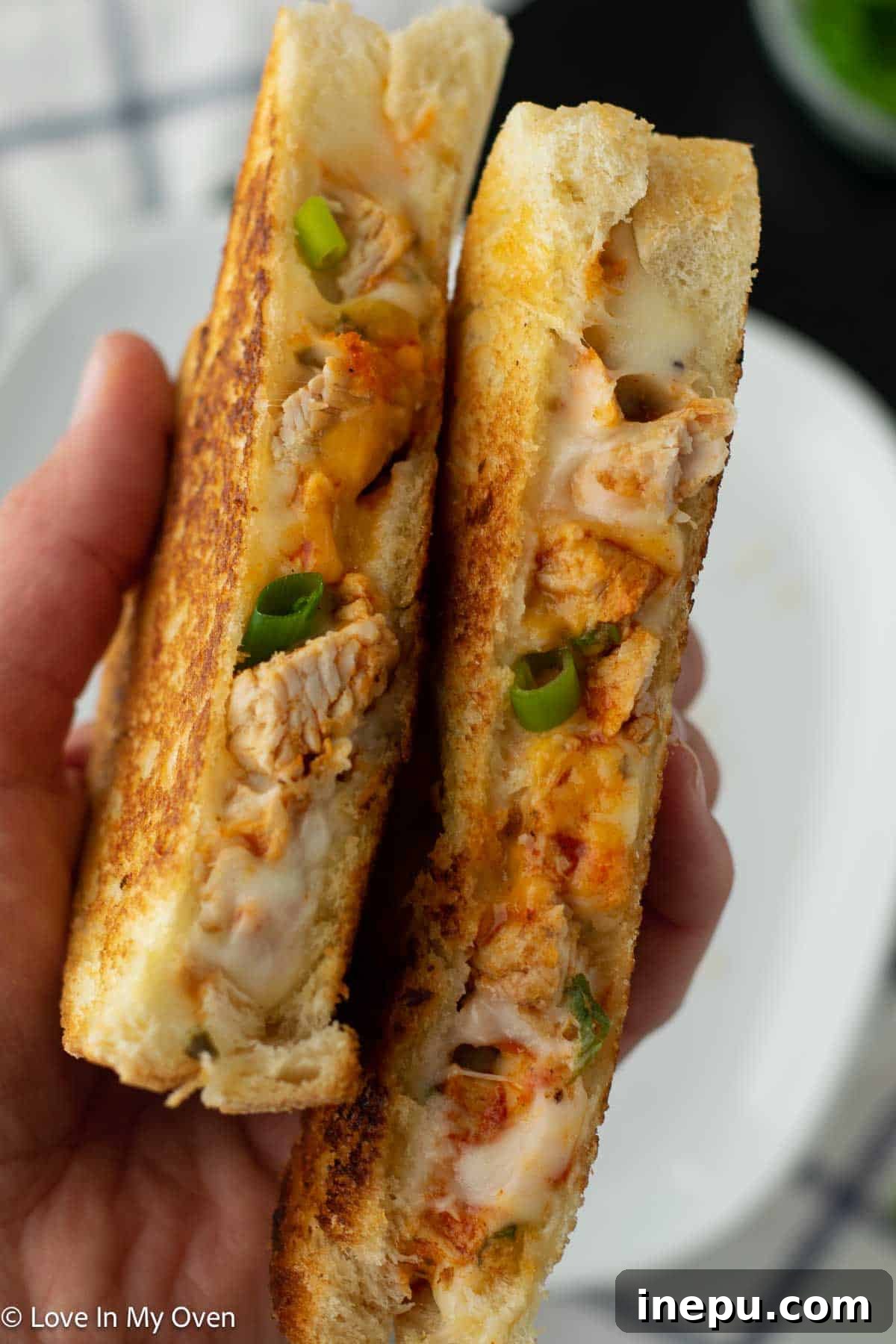 finished grilled buffalo turkey sandwich cut in half