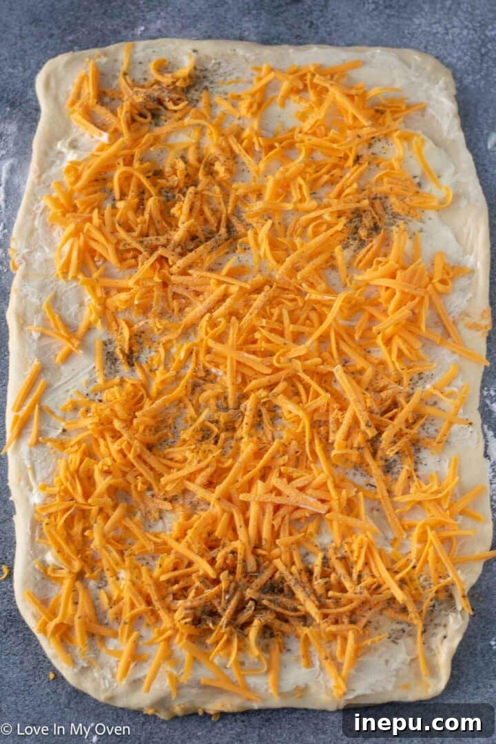 rolling out dough for cheese rolls