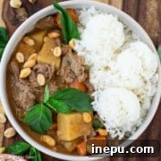 A bowl of delicious Beef Massaman Curry with rice