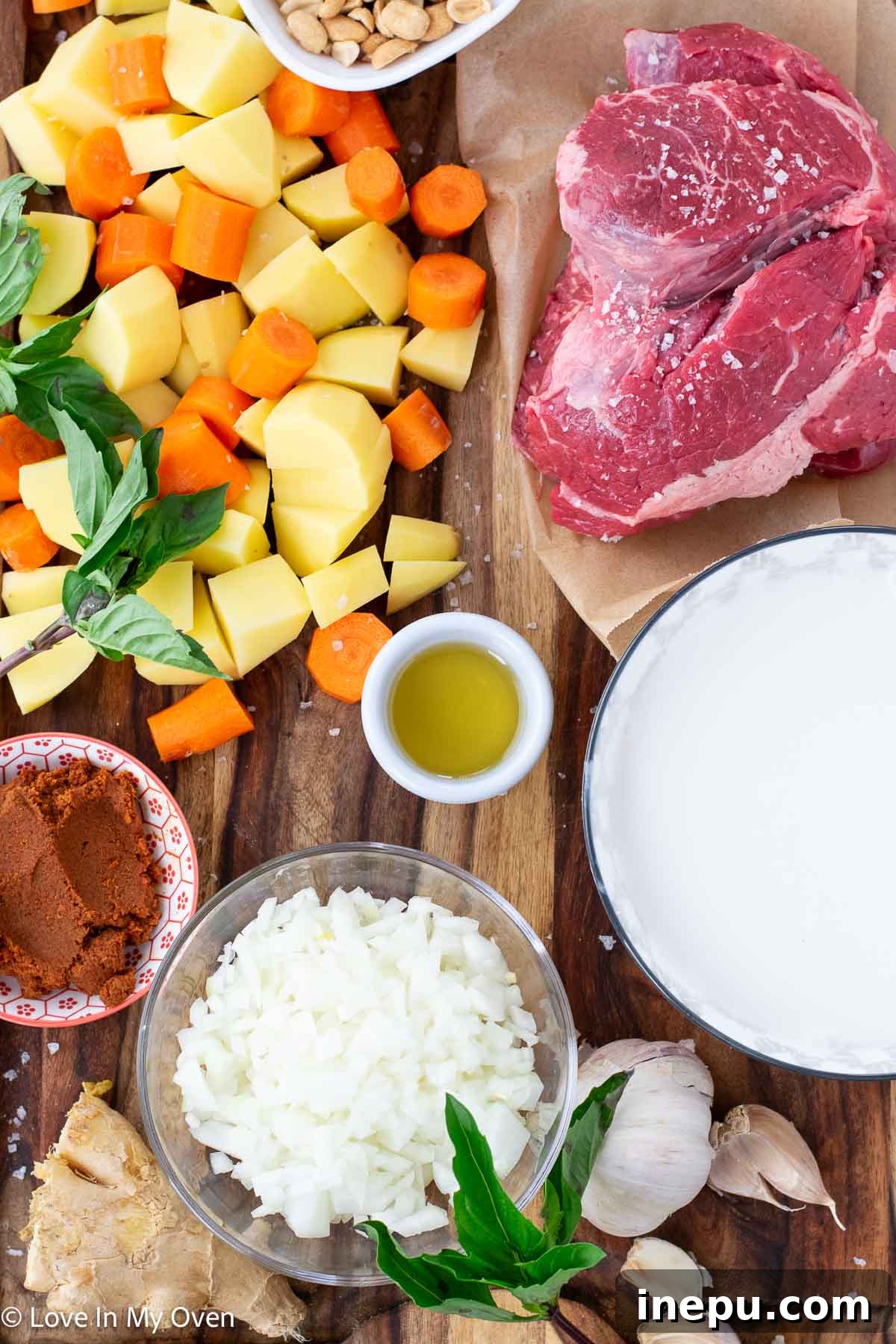 Massaman Beef Curry 3 Assortment of fresh ingredients for beef Massaman curry, including beef roast, vegetables, and curry paste