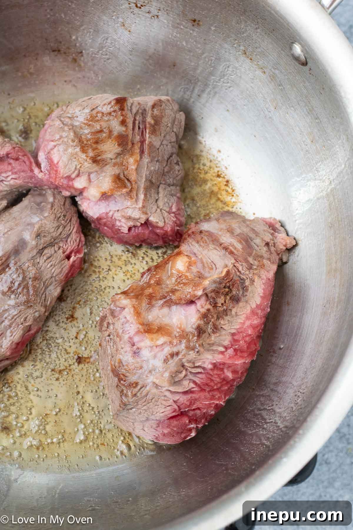 Massaman Beef Curry 6 Transferring seared beef to a plate before adding aromatics
