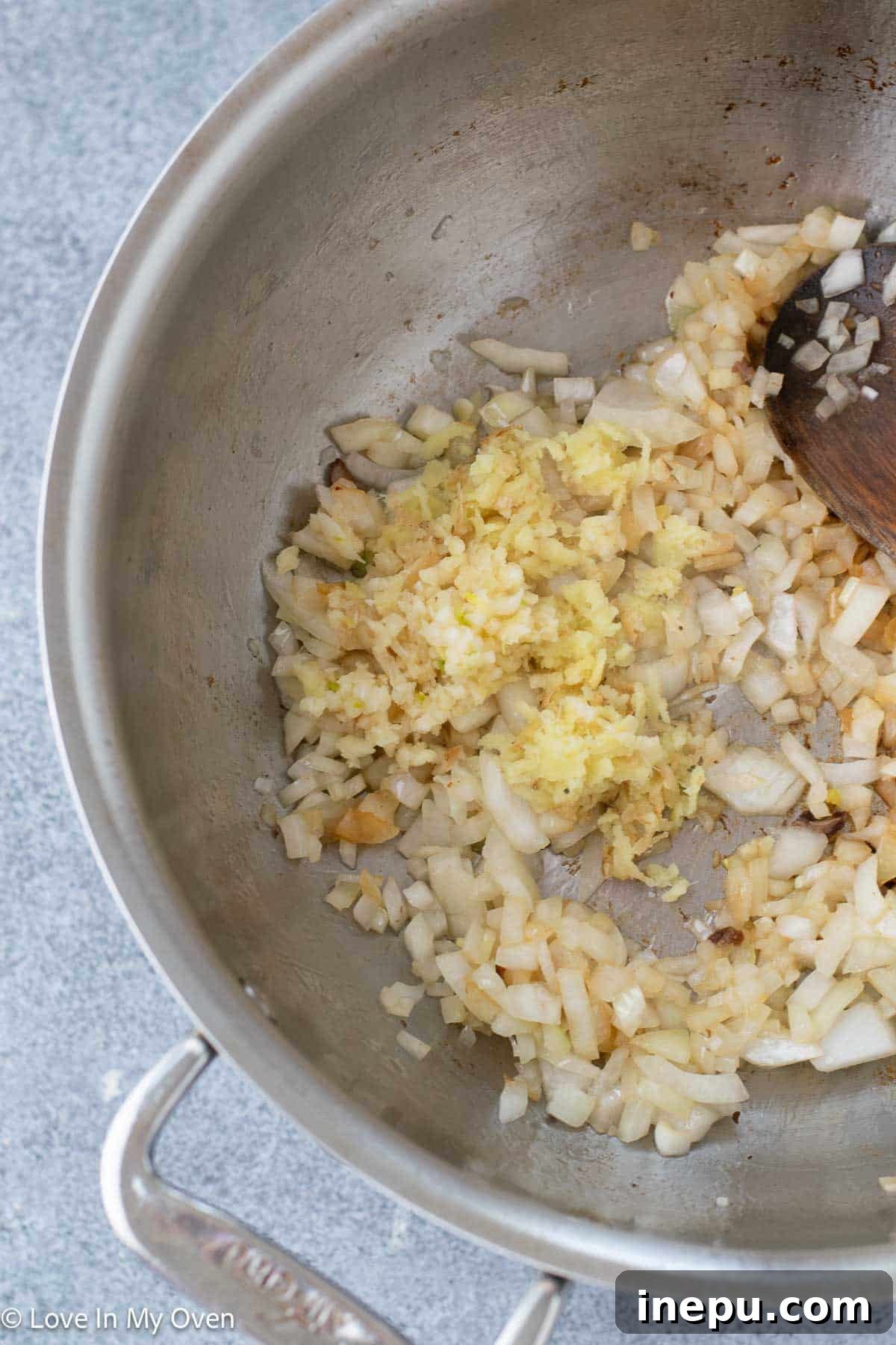 Massaman Beef Curry 7 Sautéing diced onions in a Dutch oven