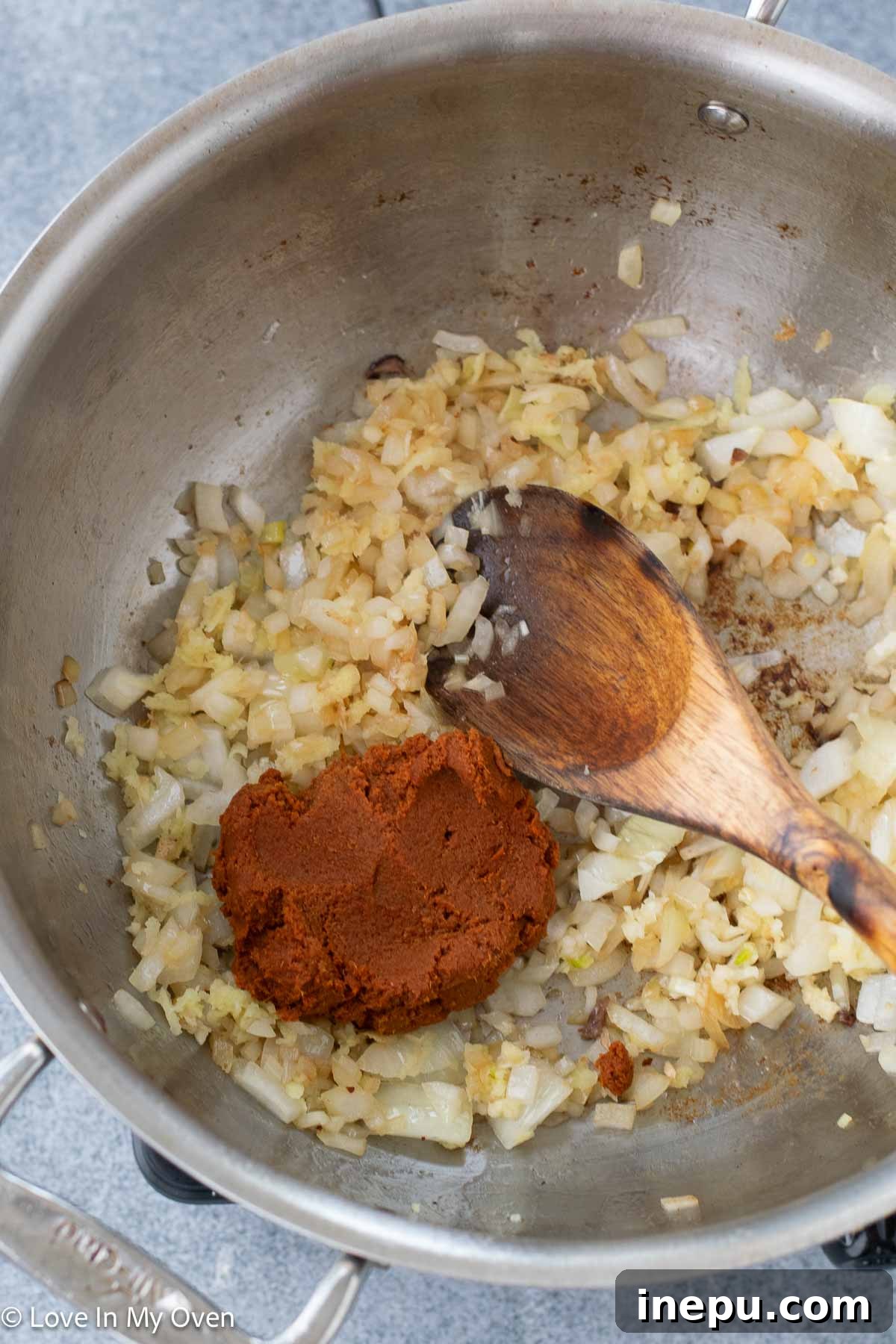 Massaman Beef Curry 8 Adding Massaman curry paste to sautéed onions and aromatics