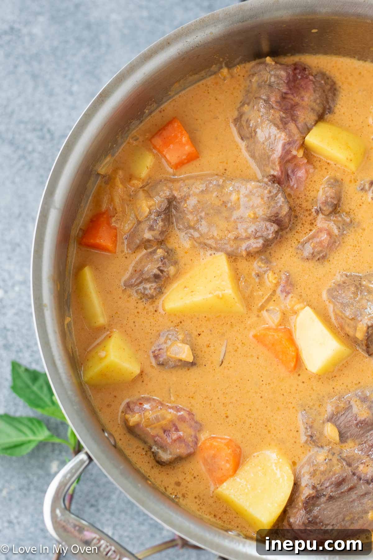 Massaman Beef Curry 9 Slow-cooked beef Massaman curry simmering in the Dutch oven