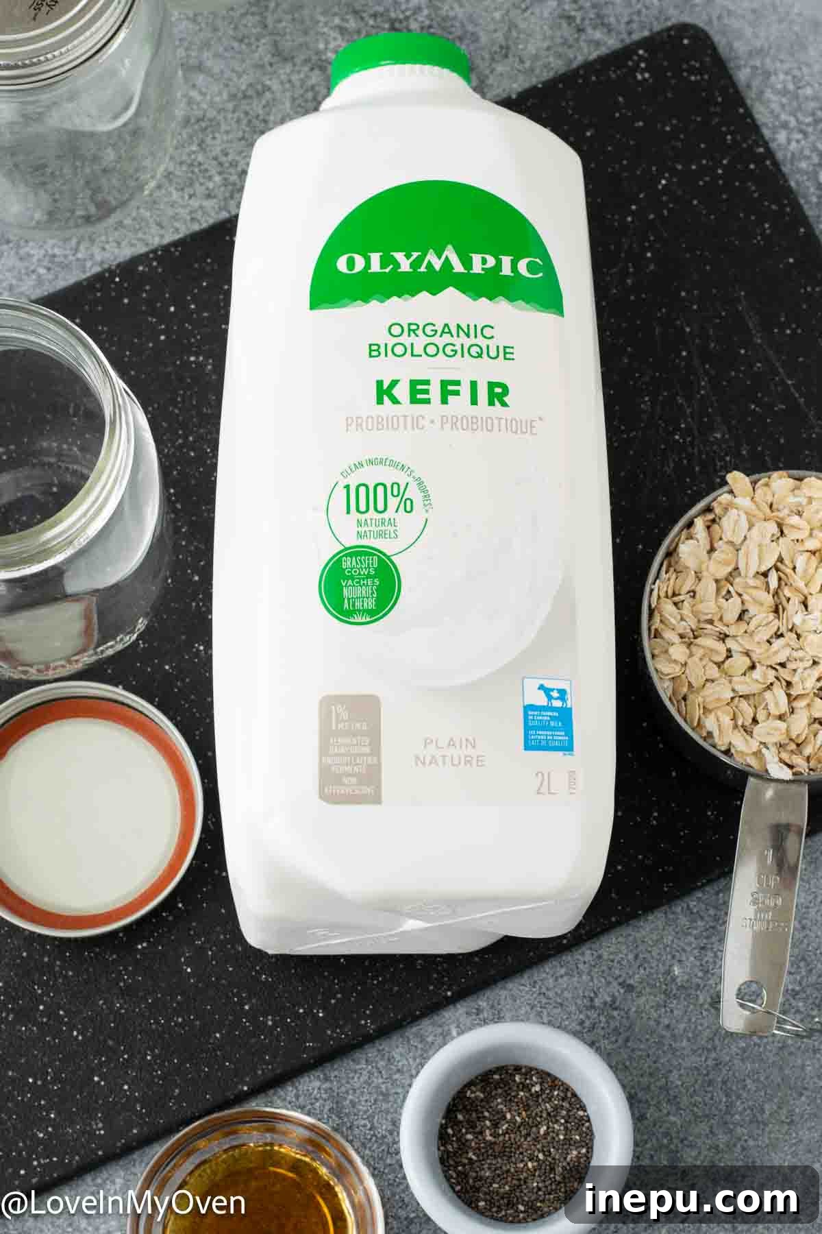 Probiotic Oat Bliss 3 Close-up of ingredients for Kefir Overnight Oats: rolled oats, maple syrup, chia seeds, and kefir milk