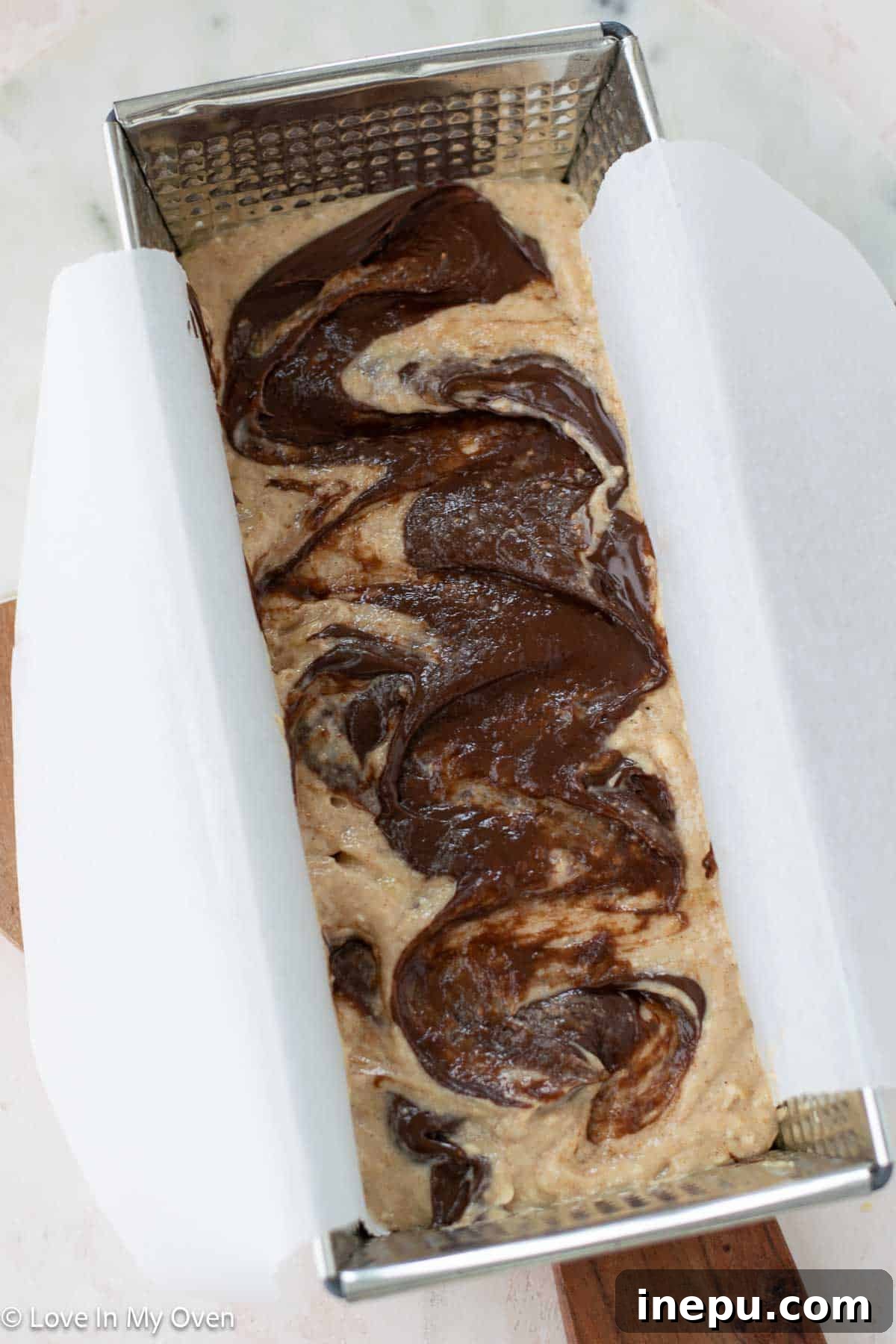 Nutella banana bread baking beautifully in the oven.