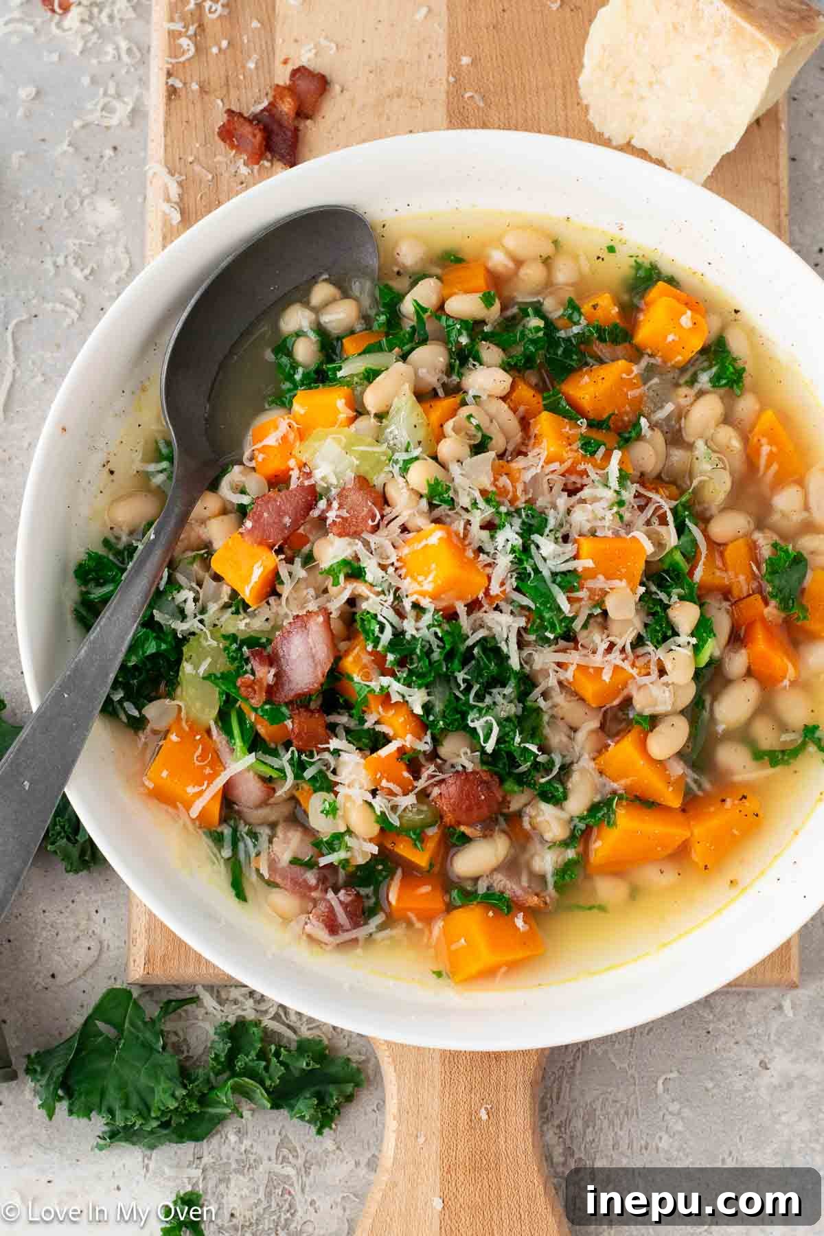 Delicious and healthy sweet potato and white bean soup topped with crispy bacon