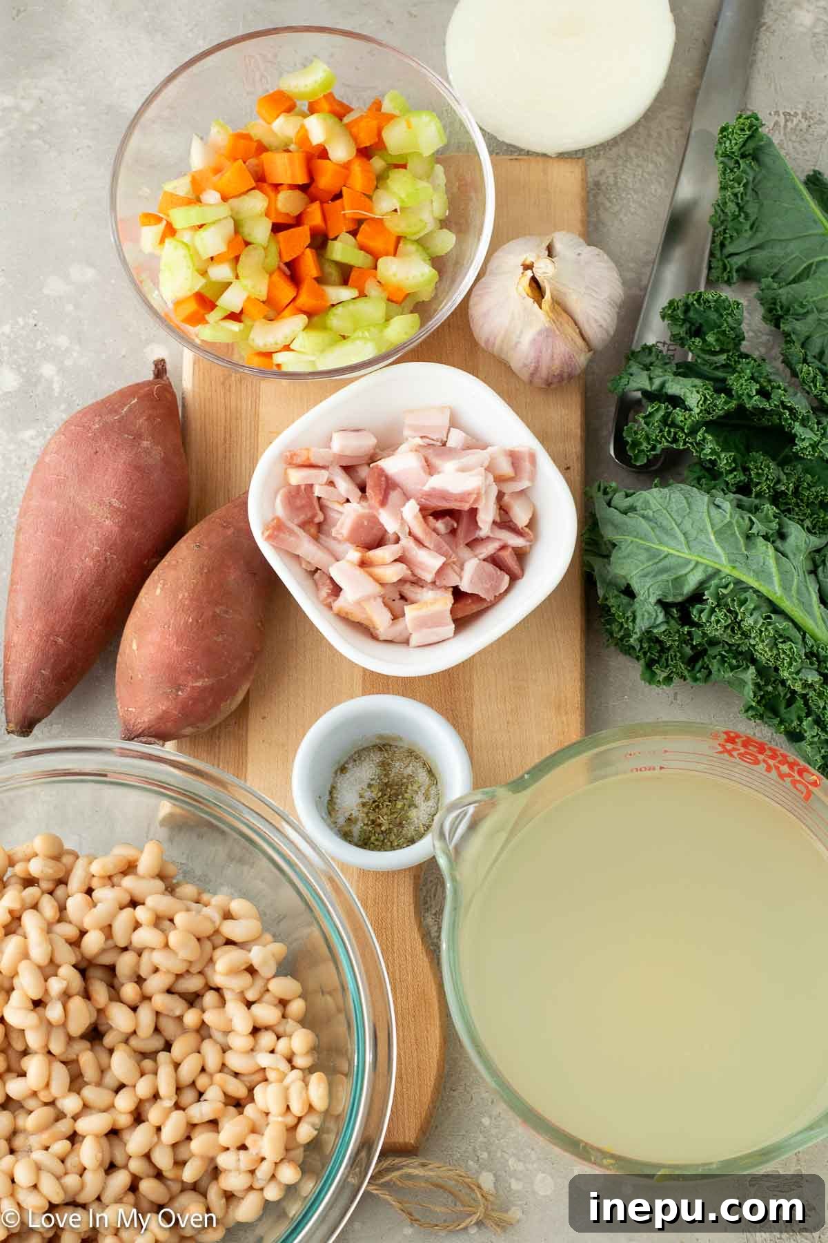 Close-up of fresh vegetables and ingredients for sweet potato and white bean soup
