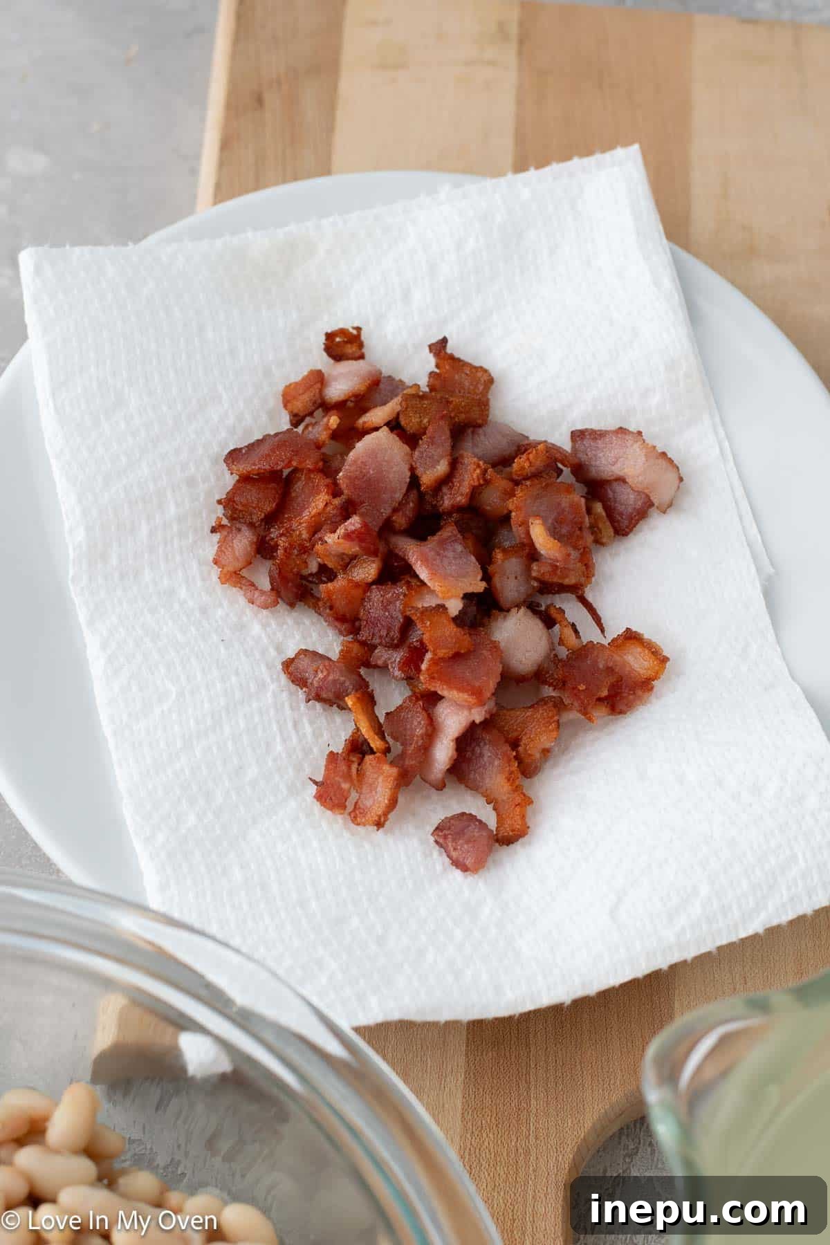 Sweet potato and white bean soup with crispy bacon topping