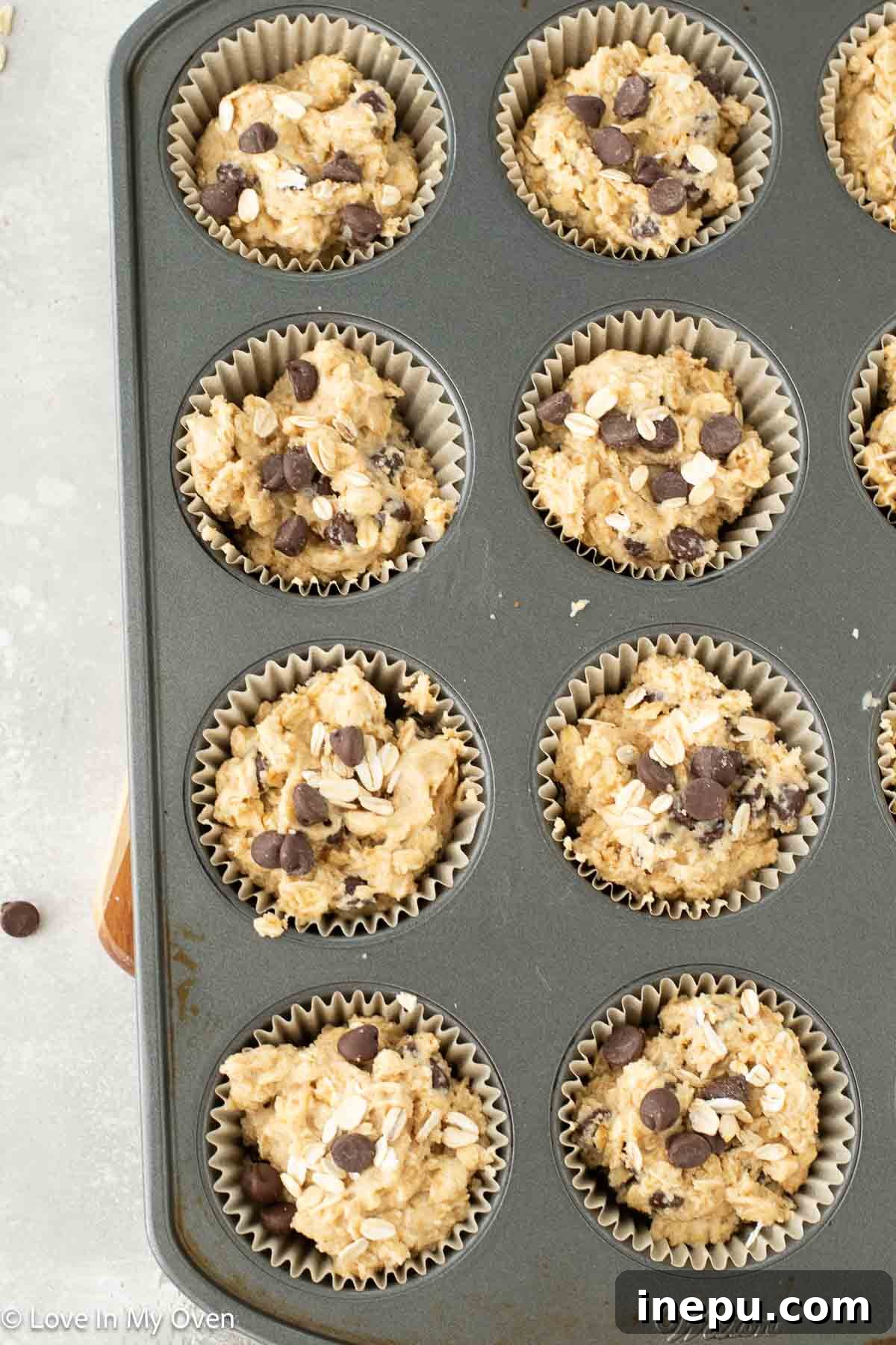 Healthier Oatmeal Chocolate Chip Muffins 7 Oatmeal chocolate chip muffins cooling on a wire rack