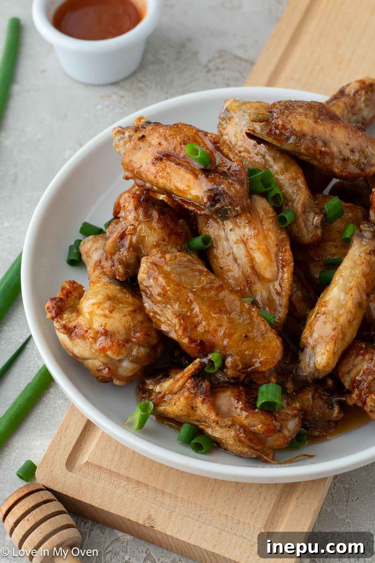 Crispy hot honey chicken wings served on a platter, perfect for game day
