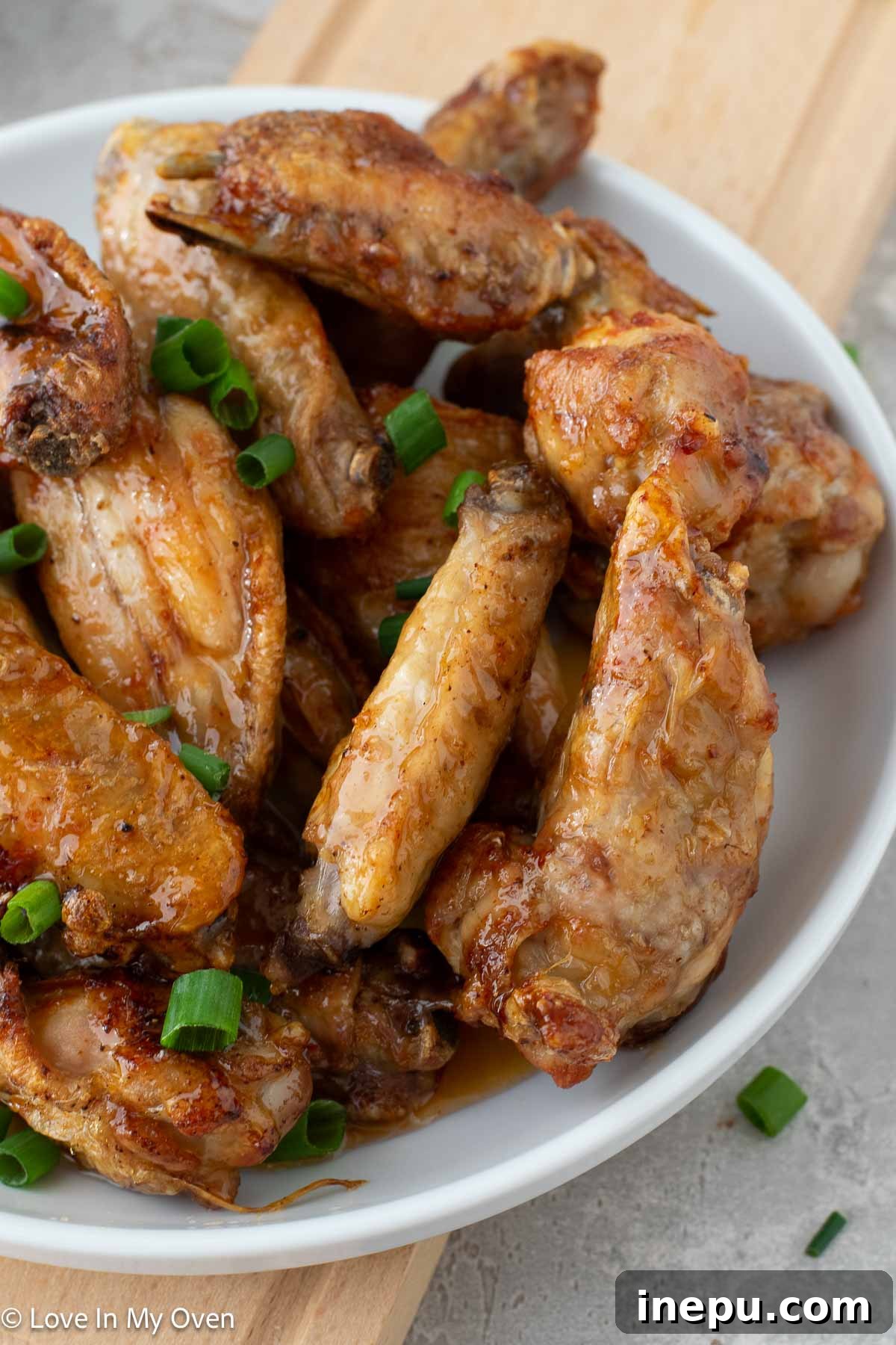 Close-up of golden crispy air fryer hot honey chicken wings
