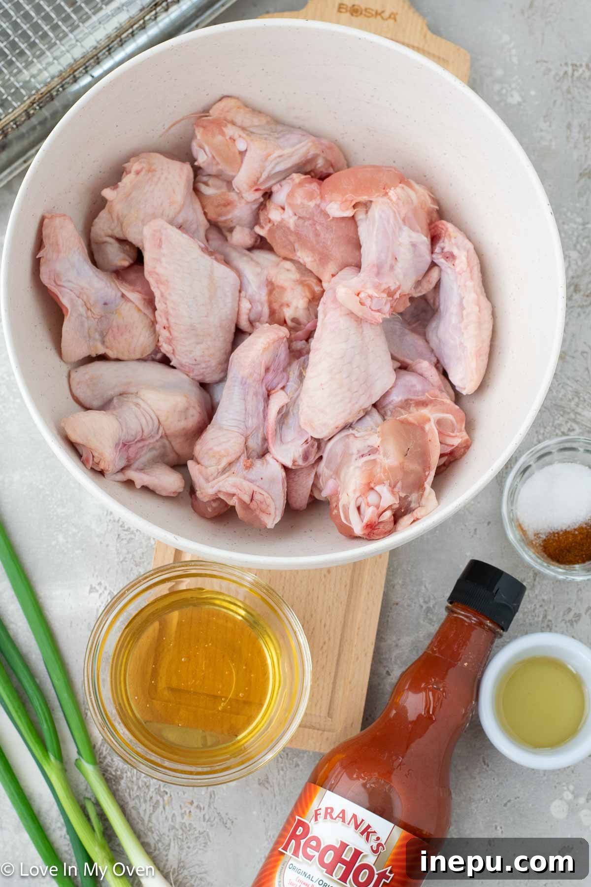 Seasoned chicken wings ready for cooking