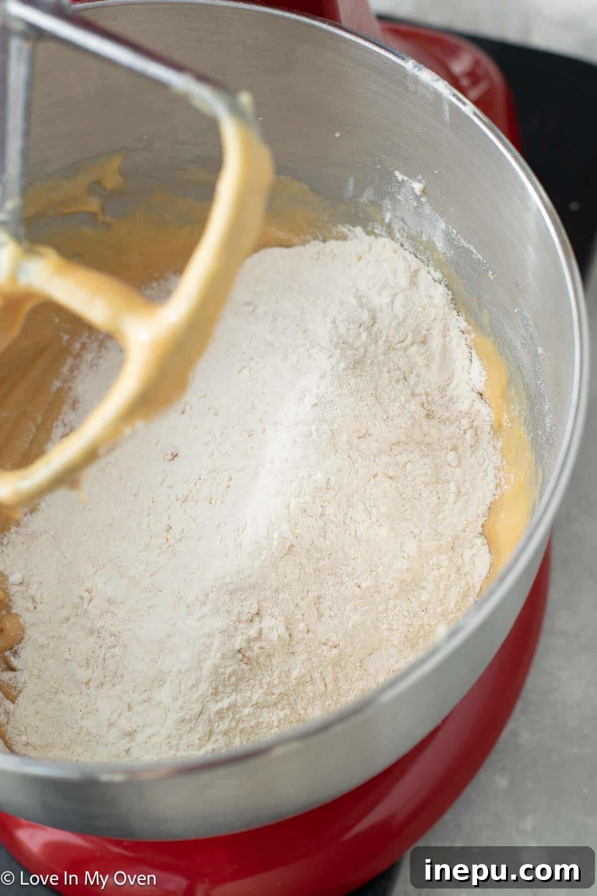Cookie Butter Dream Cake 5 Adding buttermilk to cake batter