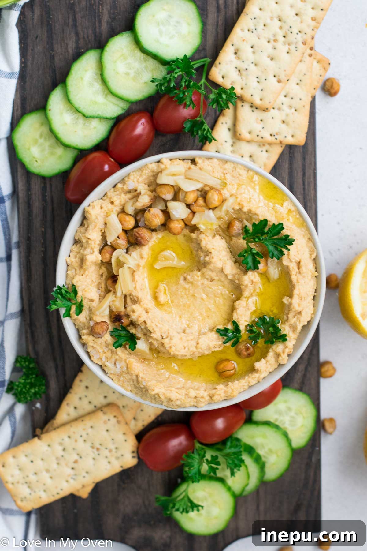 Golden Roasted Garlic Hummus 2 Creamy Roasted Garlic Hummus served with fresh vegetables and pita bread