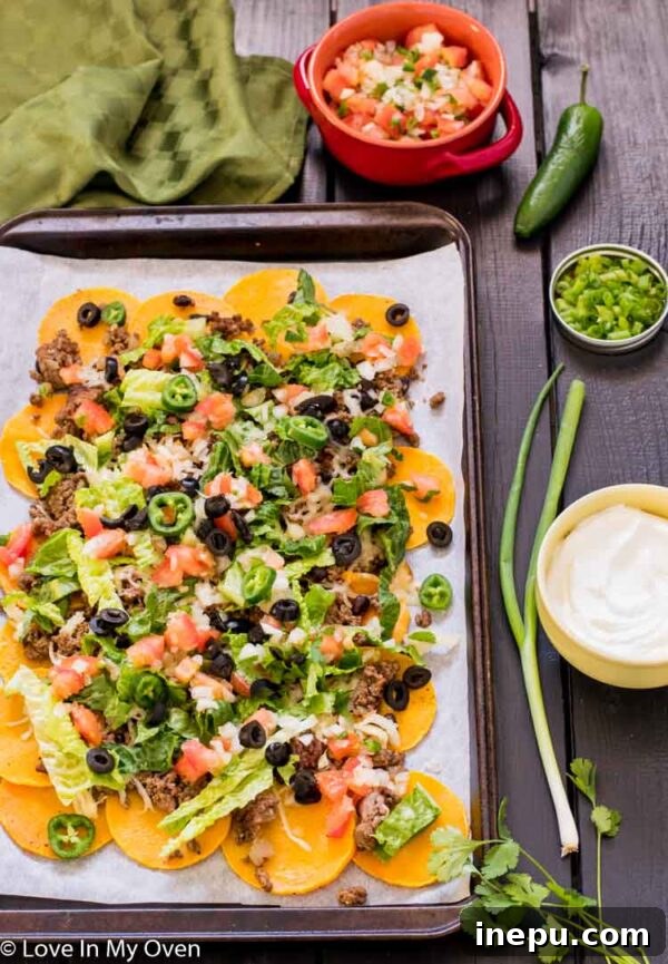 Butternachos 2 Delicious and healthy butternut squash nachos piled high with toppings.