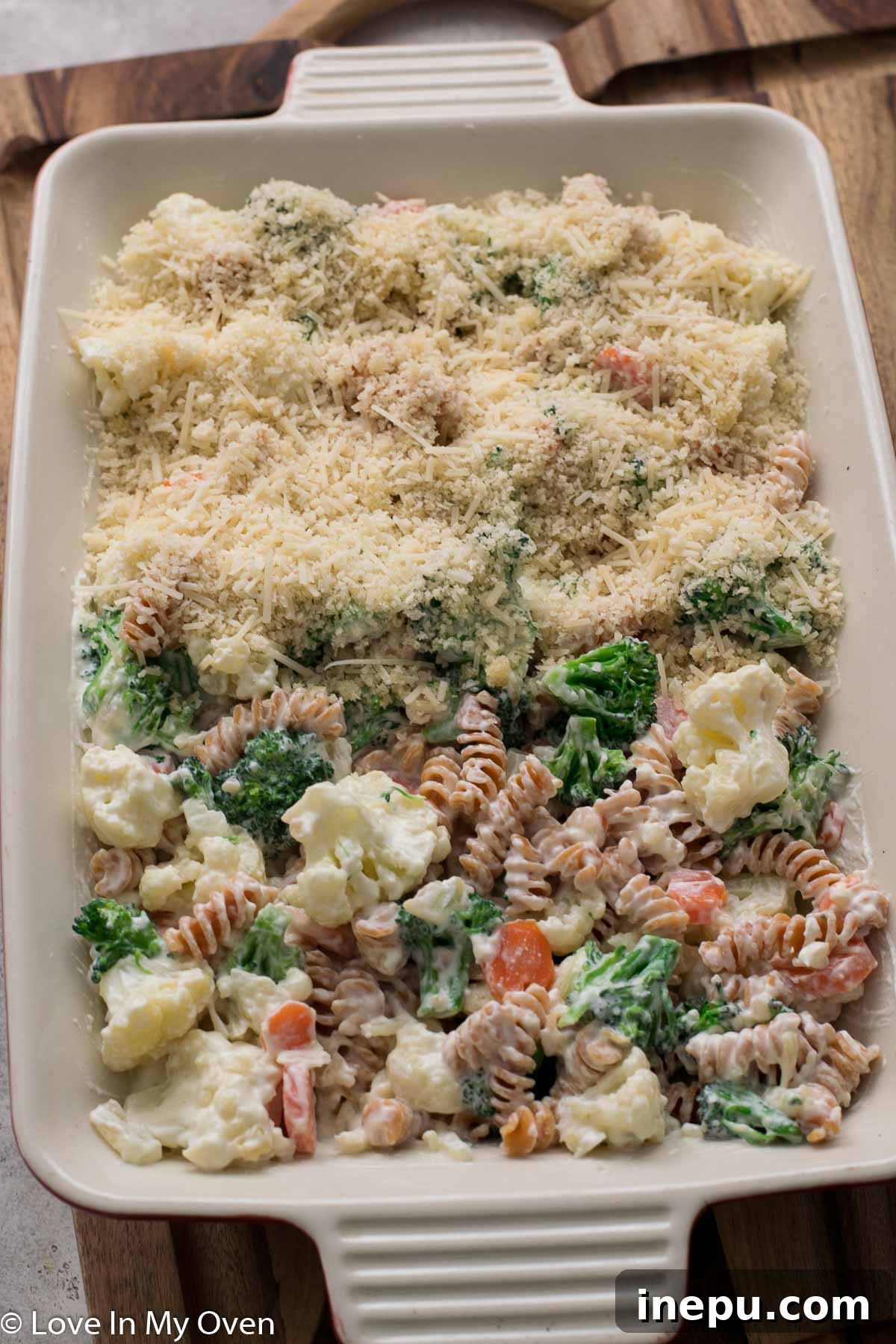 Baked creamy vegetable casserole with golden breadcrumb topping