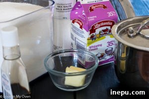 Sugar and water mixture beginning to caramelize in a saucepan