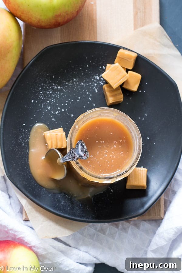 Homemade salted caramel sauce in a clear glass jar