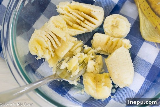 Dynamic Duo Flapjacks 4 Step 1: Mashing a ripe banana for two ingredient pancakes.