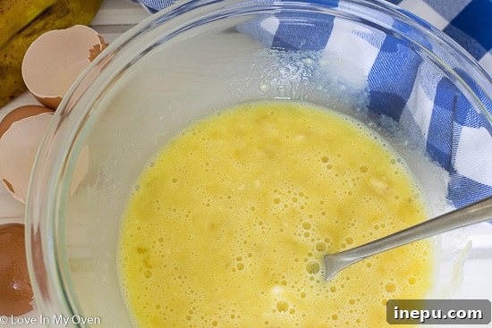 Dynamic Duo Flapjacks 6 Step 2: Whisking banana and egg mixture for two ingredient pancakes.