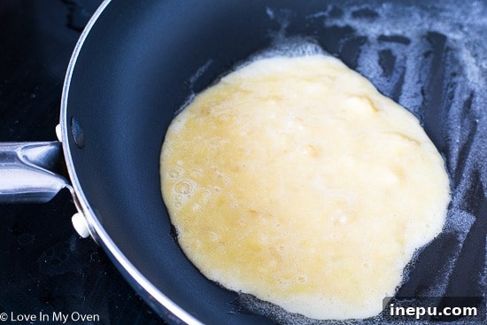 Dynamic Duo Flapjacks 7 Step 3: Frying two ingredient pancakes in a pan.