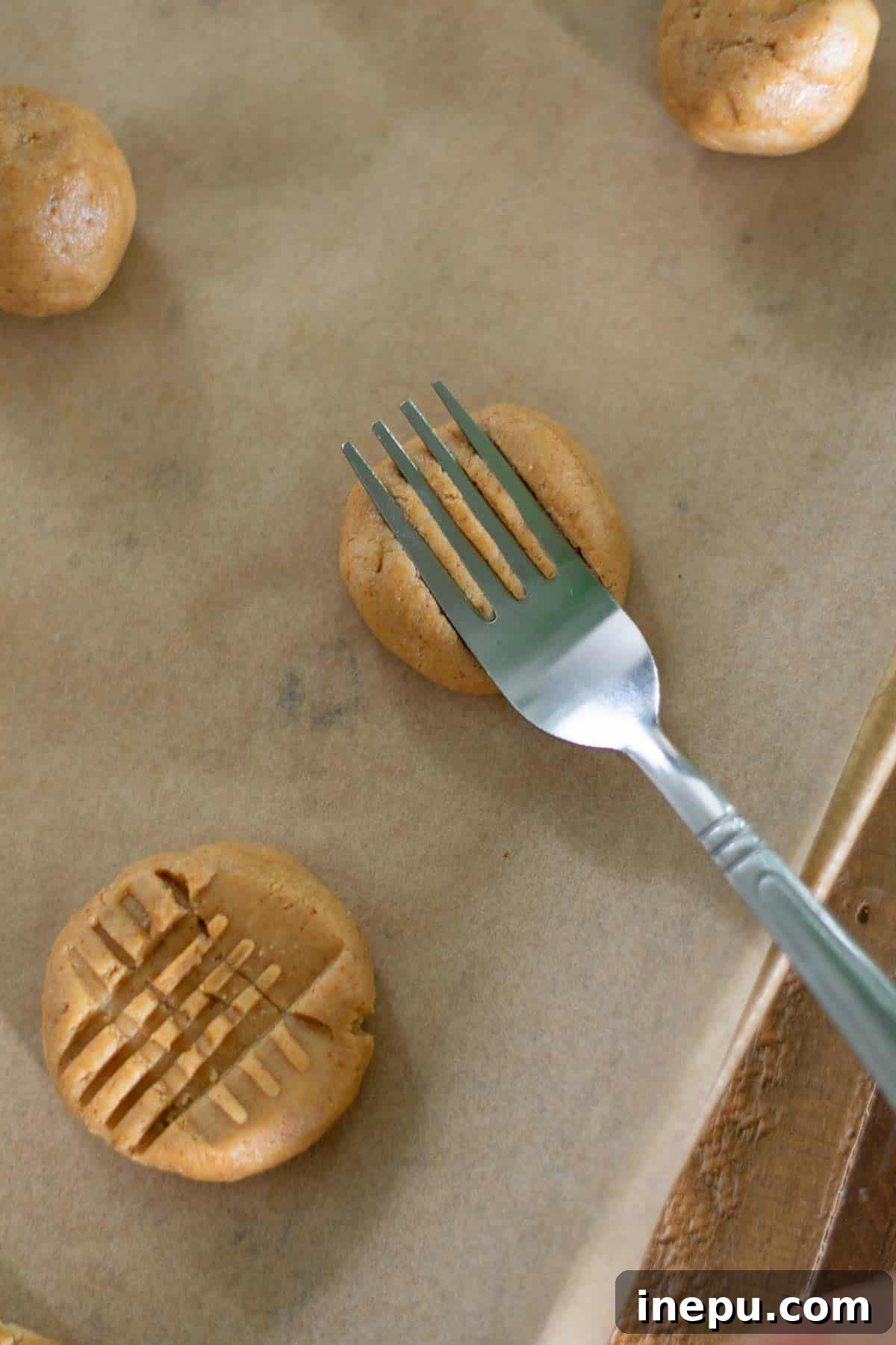 Dough rolled into balls and placed on a baking sheet
