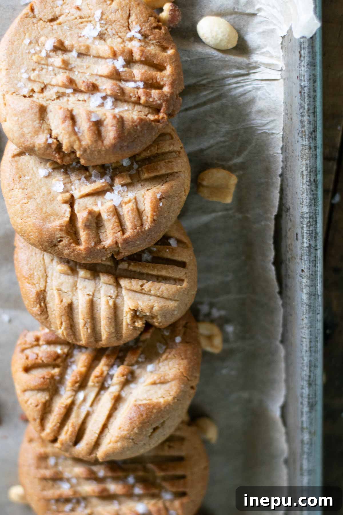 Baked 3-ingredient gluten-free peanut butter cookies on a wire rack