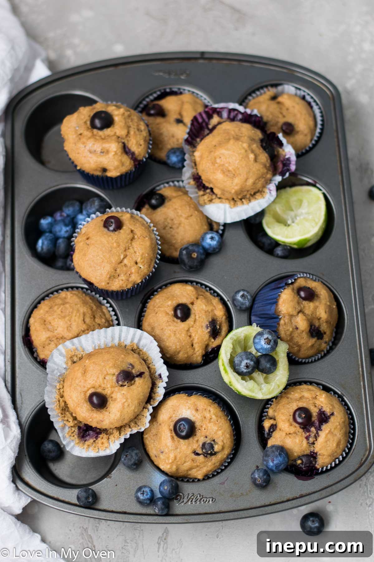 Zesty Blueberry Lime Greek Yogurt Muffins 4 Close up of a freshly baked Blueberry Lime Muffin