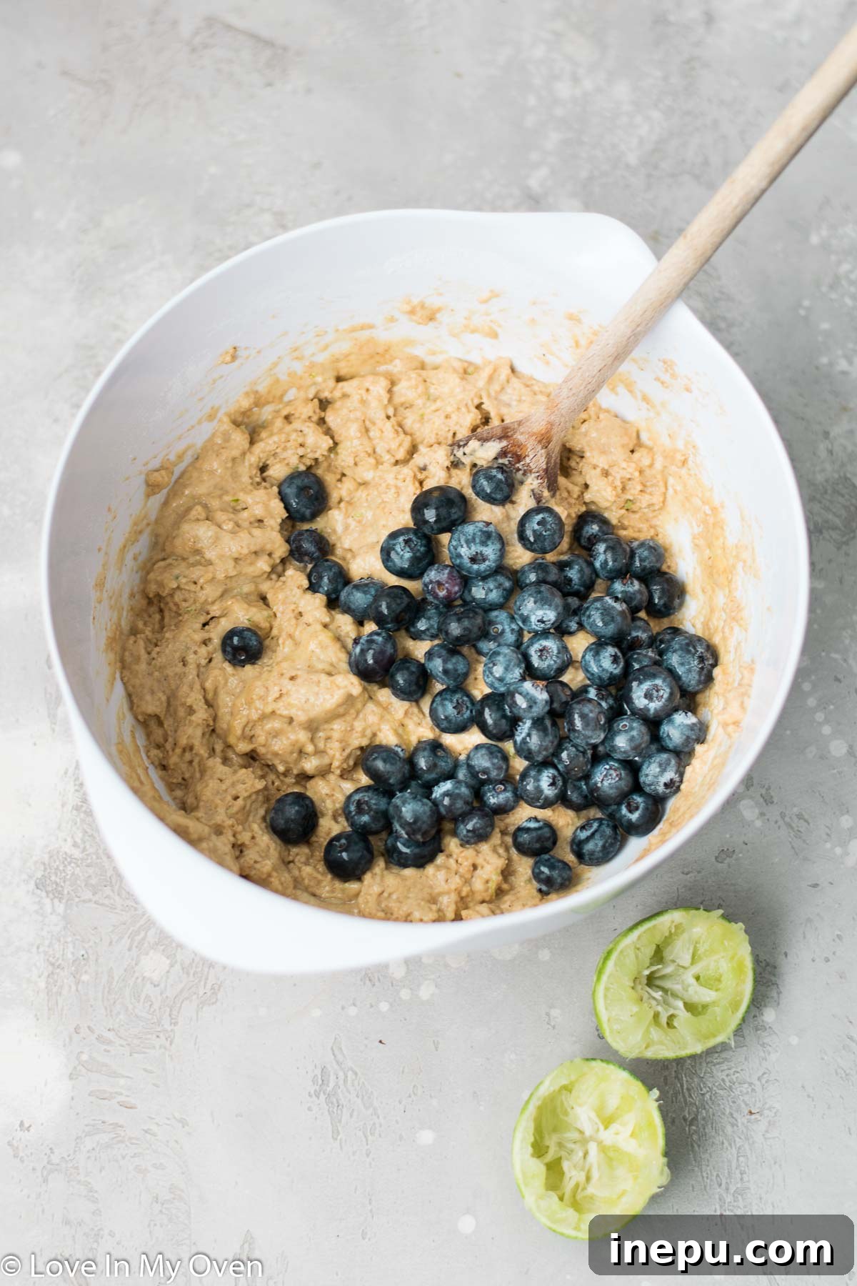 Zesty Blueberry Lime Greek Yogurt Muffins 5 Muffin batter with blueberries in a bowl