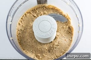 Hazelnuts transforming into butter in a food processor, showing two stages of blending.