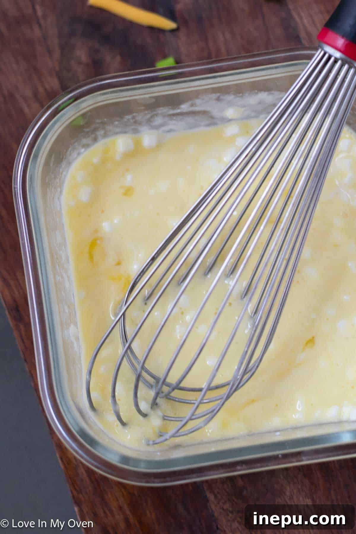 Protein-Packed Scramble 5 melting butter in pan for scrambled eggs