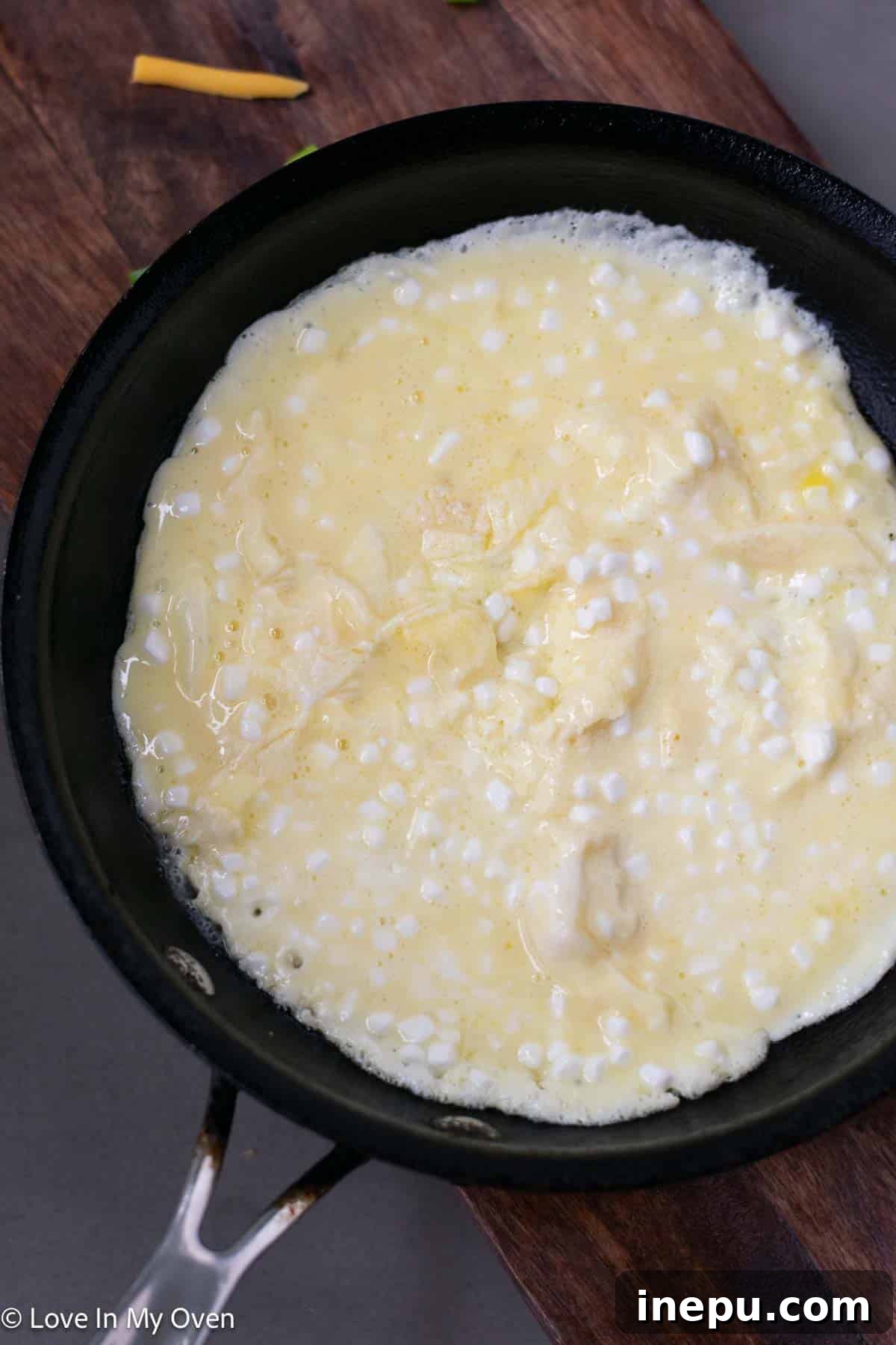 Protein-Packed Scramble 6 cooking eggs with cottage cheese in pan