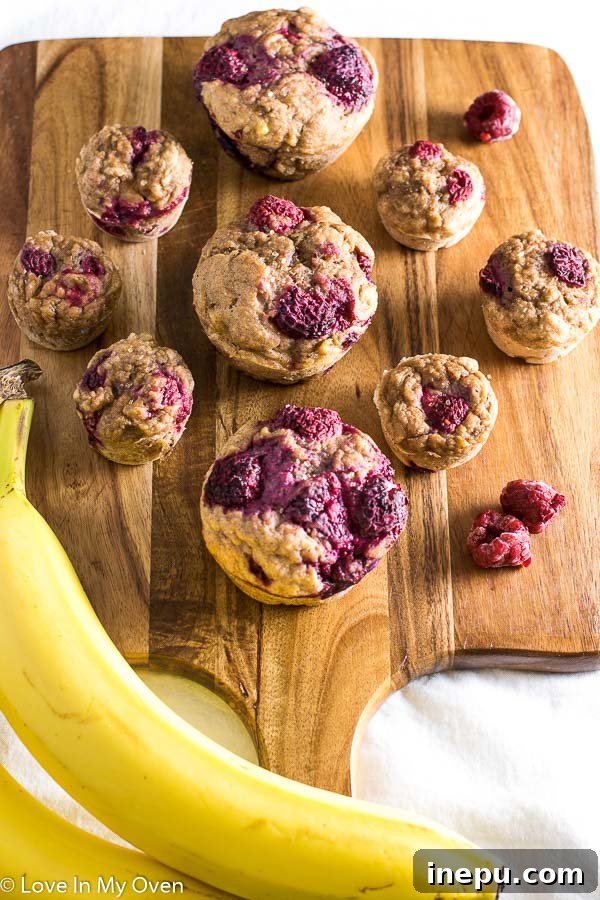 Mini Banana Muffins 3 Healthy banana muffins with raspberries, perfect for toddlers and baby led weaning.