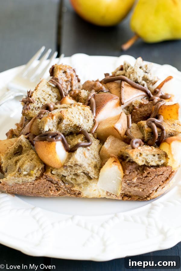 Close-up of baked Nutella Pear French Toast Casserole with melted chocolate