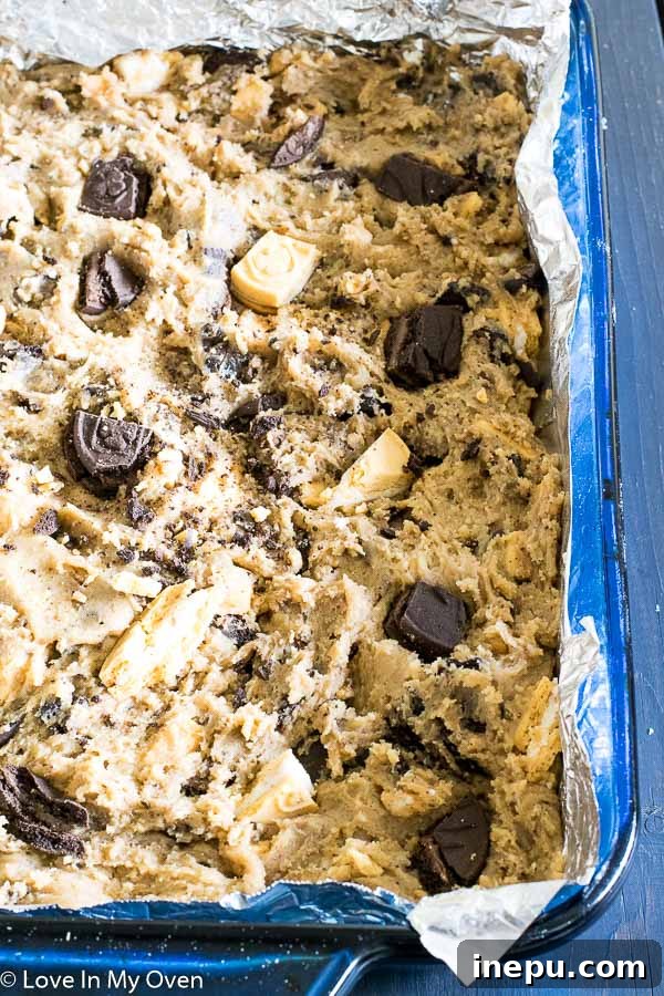Mixing bowl with cookie bar dough and crushed cookies