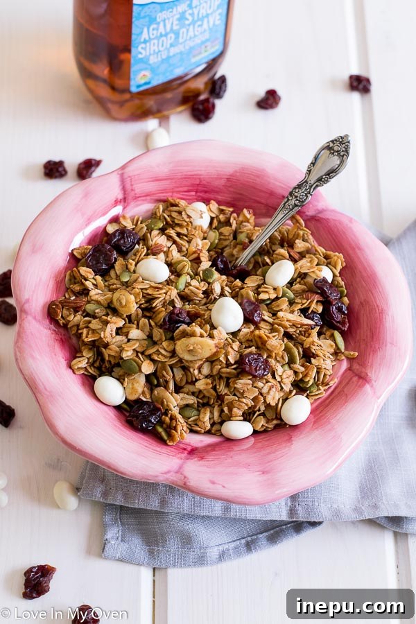 Sweet Cherry Toasted Almond Granola 4 Cherry almond granola ingredients being mixed with agave syrup and coconut oil