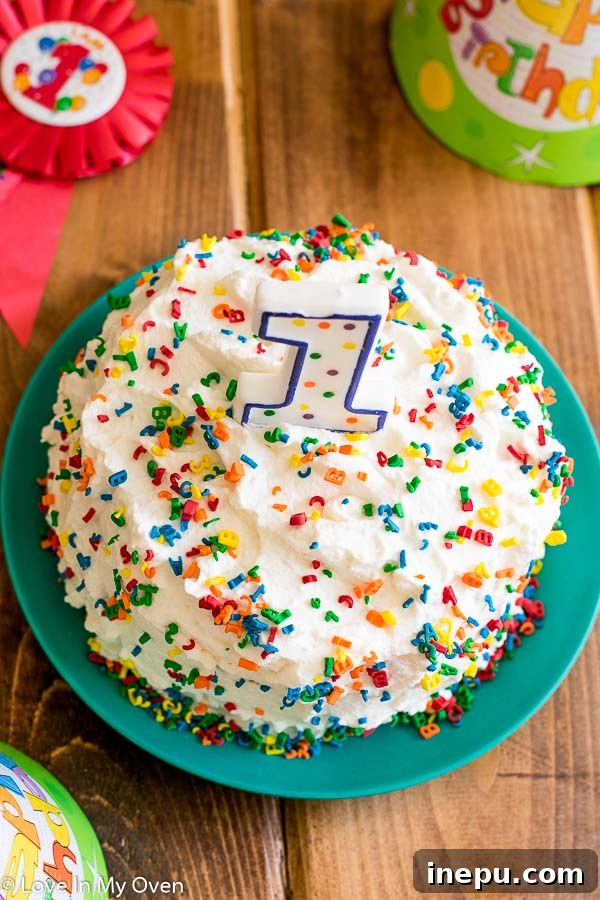 Healthy smash cake with natural fruit frosting for a baby's birthday.