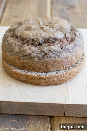 Applying frosting to a healthy smash cake layer.