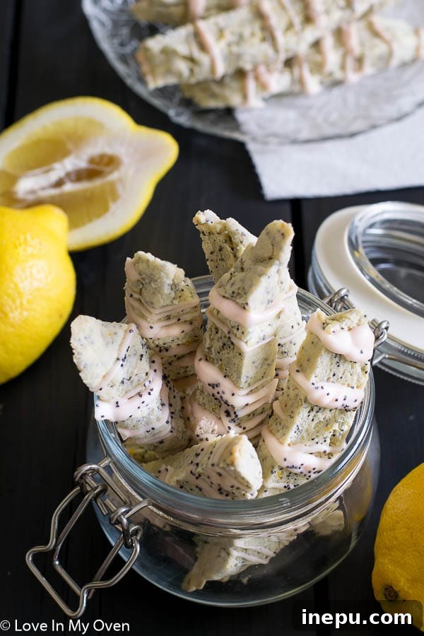 Zesty Lemon Poppy Seed Biscotti 2 Delicious homemade lemon poppy seed biscotti with white chocolate drizzle, perfect for coffee or tea