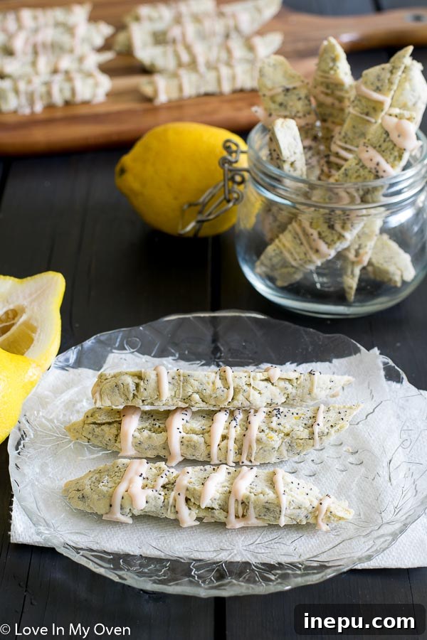 Zesty Lemon Poppy Seed Biscotti 3 Close-up of golden brown lemon poppy seed biscotti, highlighting their crisp texture