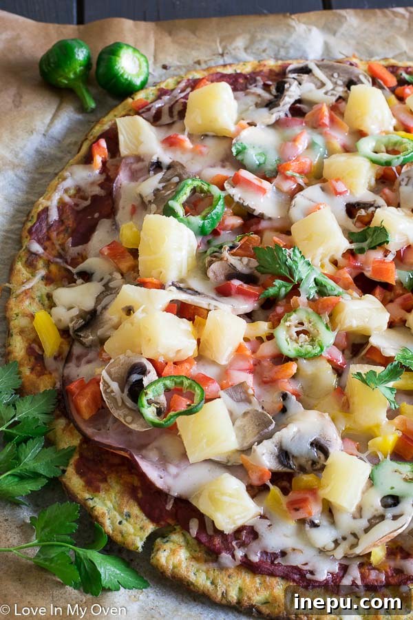 Gluten-Free Zucchini Crust Pizza 7 Loaded gluten-free zucchini pizza, ready for the oven