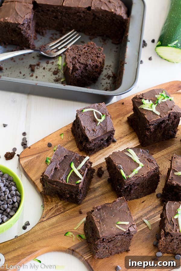 Guilt-Free Double Chocolate Zucchini Brownies 6 Stack of healthy double chocolate zucchini brownies with frosting