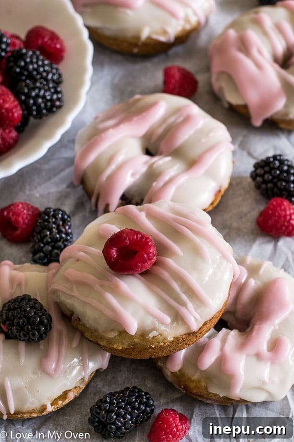 Fresh Berry Donuts - Homemade baked donuts loaded with mixed berries before glazing.