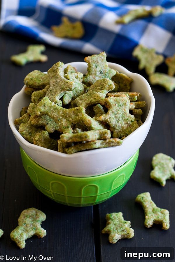 Emerald Crackers 2 green monster crackers - freshly baked spinach and parmesan crackers on a wire rack
