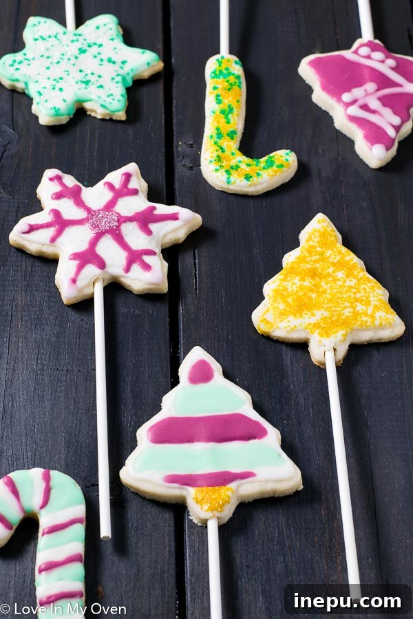 Holiday Cookie Pops 5 A finished vanilla bean cookie pop with white royal icing, ready for holiday gifting or enjoyment.