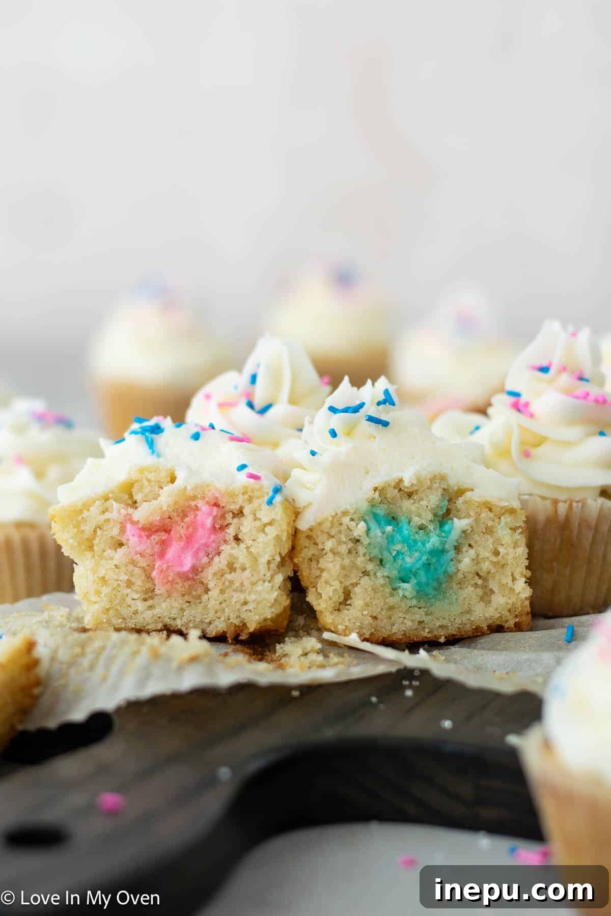 Sweet Gender Surprise 2 Gender Reveal Cupcakes: A sweet way to announce your baby's gender with hidden pink or blue frosting inside fluffy white chocolate cupcakes.